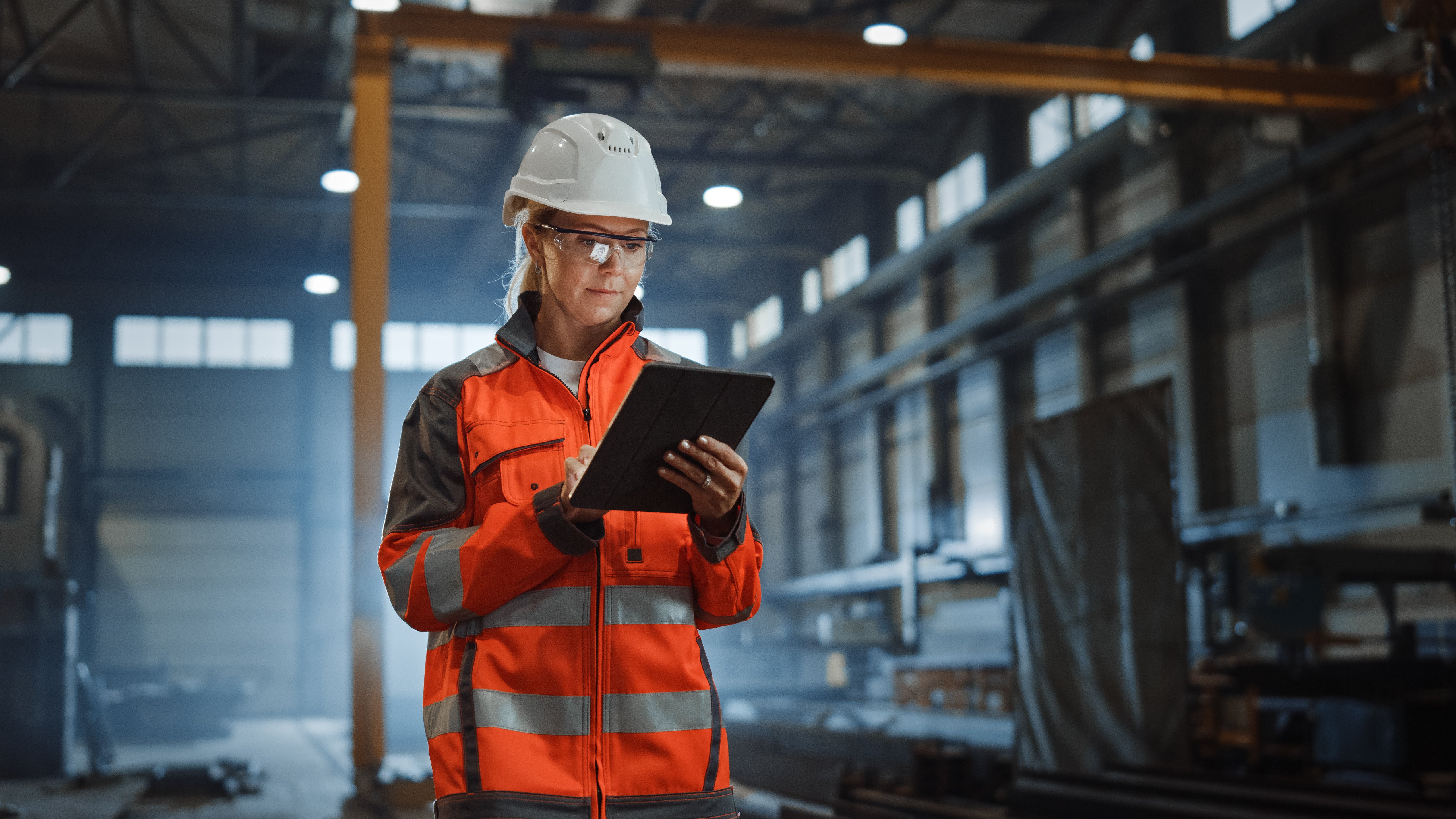 Construction woman holding a tablet 